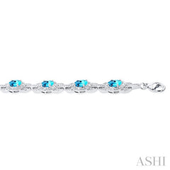 7x5 MM Oval Shape Blue Topaz and 1/10 Ctw Round Cut Diamond Semi-Precious Bracelet in Sterling Silver